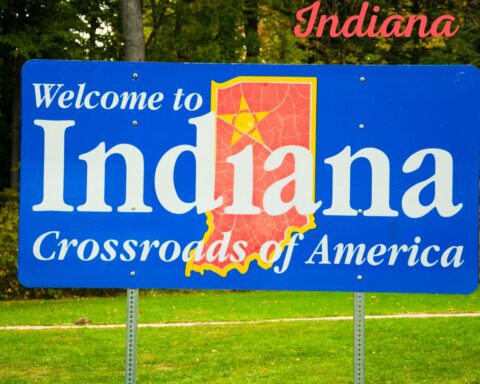 Indiana welcome sign reading “Crossroads of America”