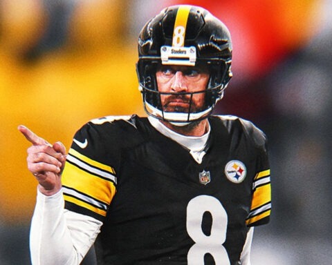 Aaron Rodgers in a Pittsburgh Steelers uniform pointing during a game