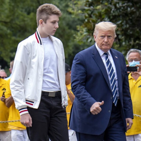 Barron Trump standing on White House steps with Donald Trump during press statement
