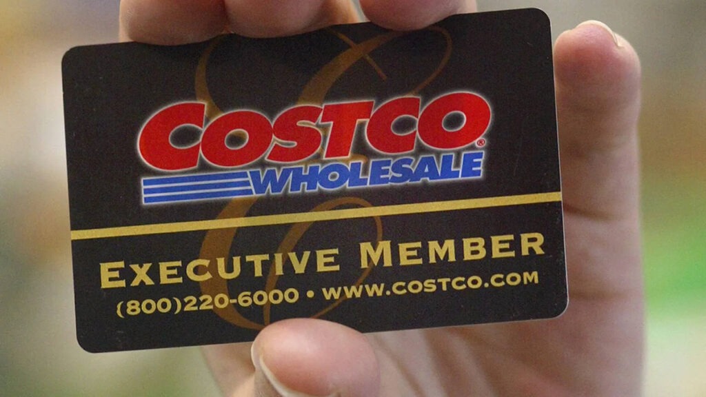 Close-up of a hand holding a black Costco Executive Member card