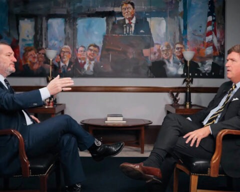 Tucker Carlson interviews Sen. Ted Cruz in front of a Ronald Reagan painting