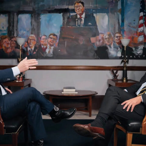 Tucker Carlson interviews Sen. Ted Cruz in front of a Ronald Reagan painting