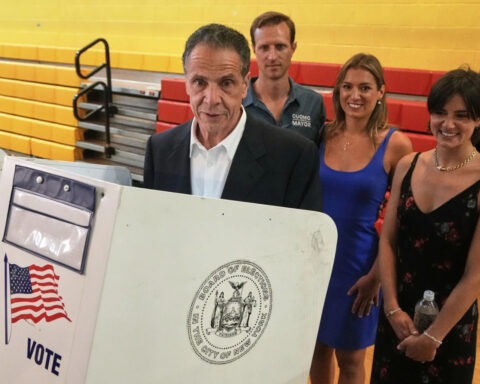 Andrew Cuomo speaking at podium in New York City campaign event