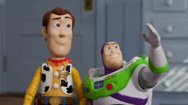 Woody and Buzz Lightyear from Toy Story standing together in a child’s bedroom