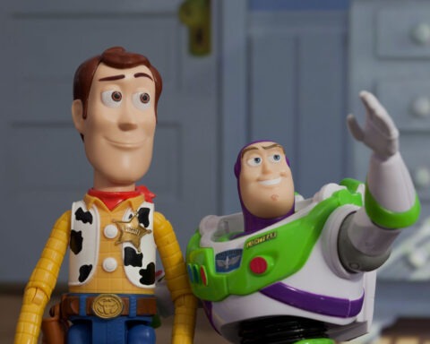 Woody and Buzz Lightyear from Toy Story standing together in a child’s bedroom