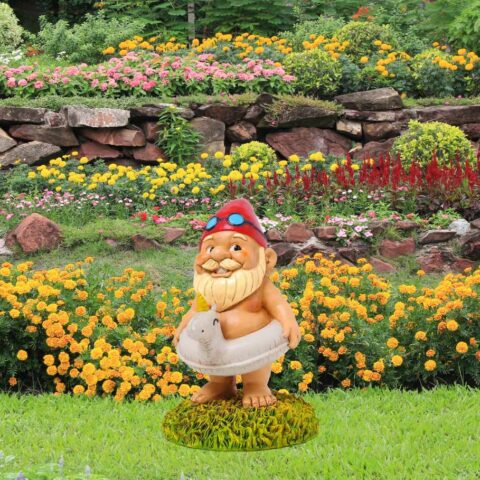 Garden gnome with red hat and unicorn floatie