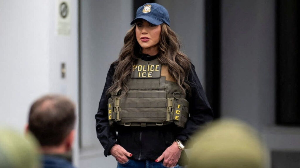 Kristi Noem wearing ICE tactical vest and hat during DHS media event