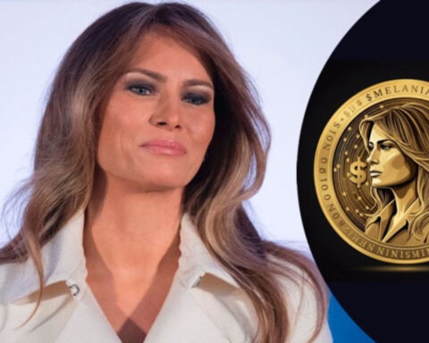 Melania Trump poses beside golden digital coin during crypto launch