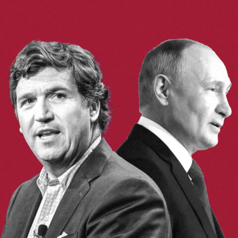 Tucker Carlson and Vladimir Putin seated together in formal meeting