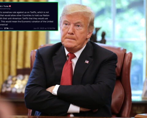 Donald Trump sits with arms crossed in the Oval Office