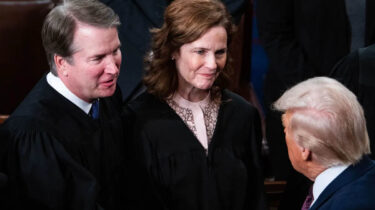 Donald Trump speaking to Supreme Court Justices Amy Coney Barrett and Brett Kavanaugh during a formal event