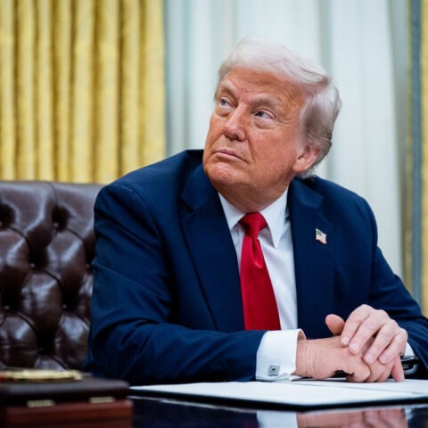 Donald Trump seated in Oval Office launching TruthTrade stock app