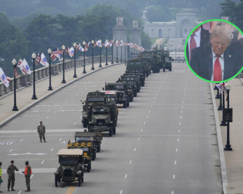 Military vehicles line an empty street for Trump’s birthday parade as Trump appears to nap during the event