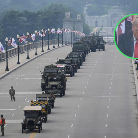 Military vehicles line an empty street for Trump’s birthday parade as Trump appears to nap during the event