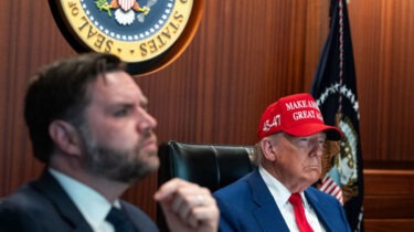 Donald Trump wearing MAGA hat in Situation Room next to JD Vance