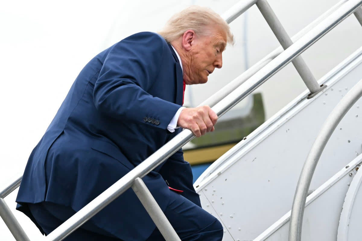 Donald Trump stumbles while climbing stairs to Air Force One