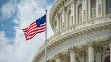 US Capitol Building with Waiving Flag