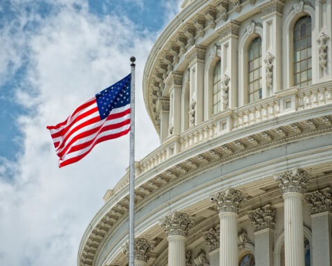 US Capitol Building with Waiving Flag