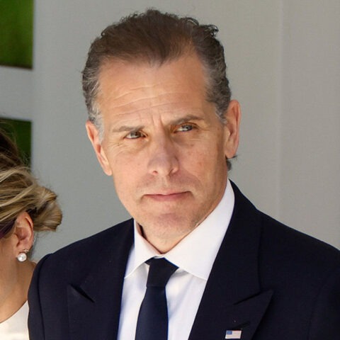 Hunter Biden in suit with woman in sunglasses