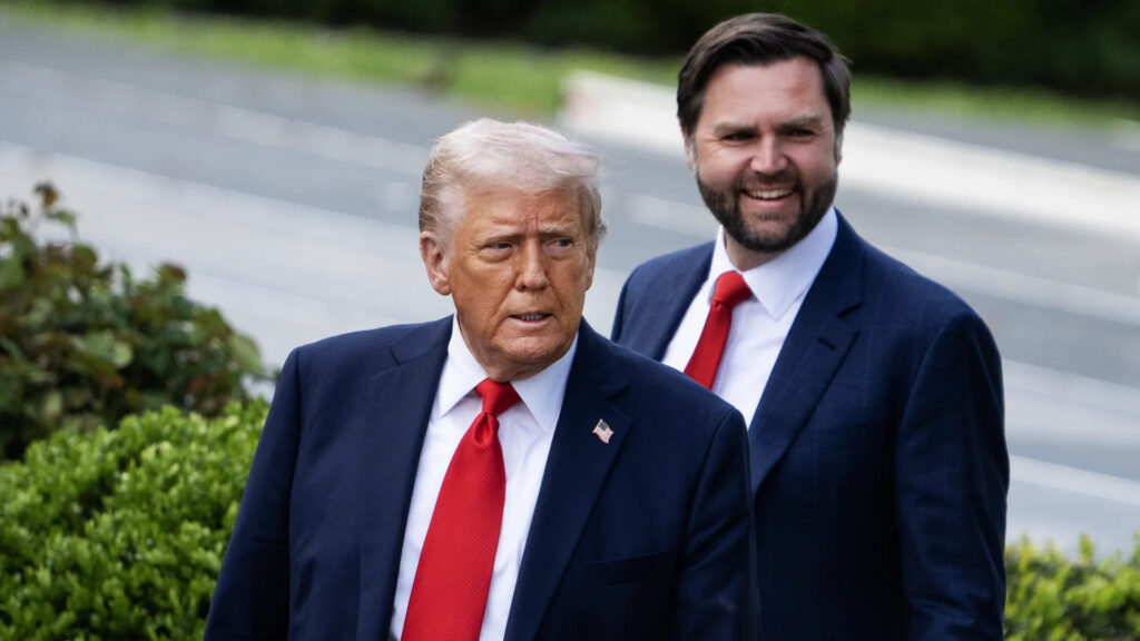 Donald Trump and JD Vance standing outside, both wearing red ties