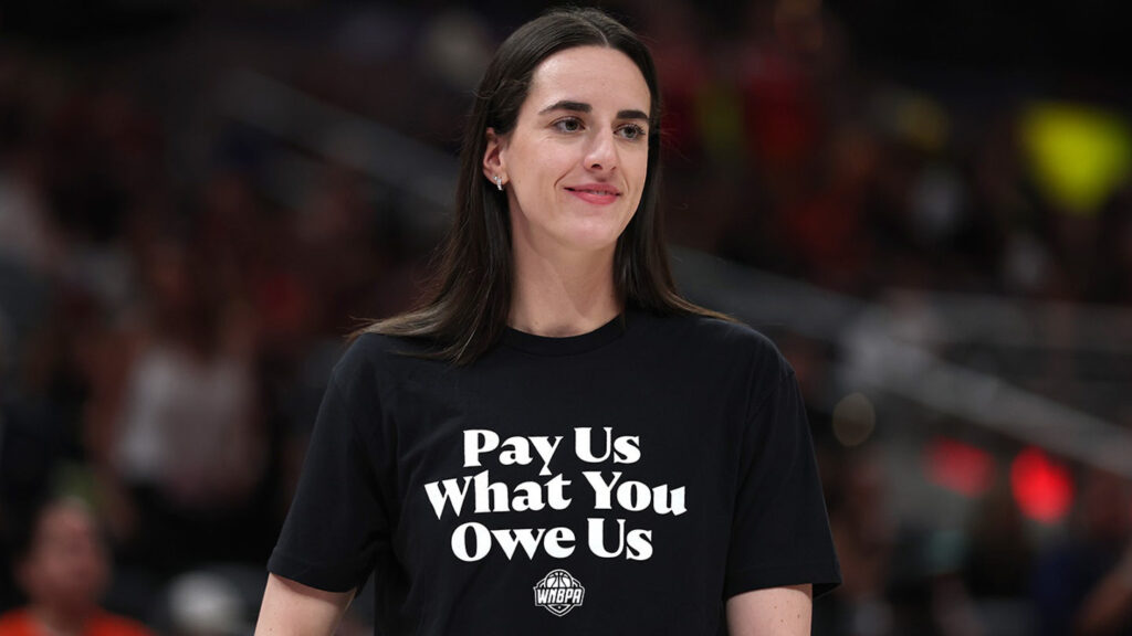 Caitlin Clark wearing shirt that says “Pay Us What You Owe Us” during WNBA All-Star Weekend