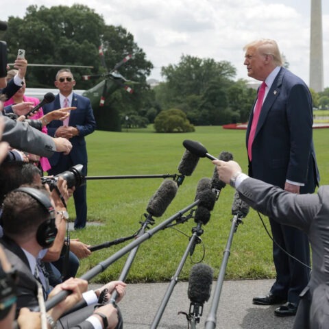 President Trump speaks to reporters on White House lawn with Marine One in background
