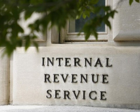 IRS building exterior with budget cuts protest signage