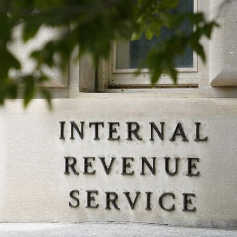 IRS building exterior with budget cuts protest signage