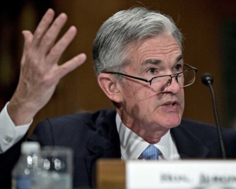 Jerome Powell gesturing during Senate testimony