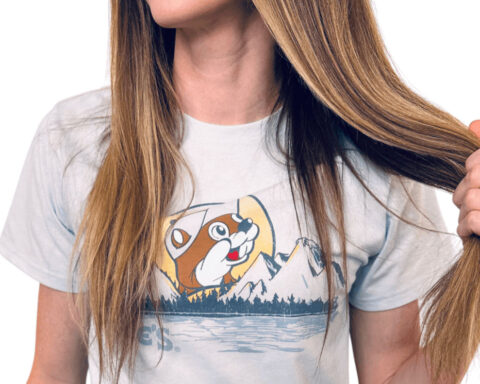 Woman wearing Buc-ee’s t-shirt pulling hair playfully
