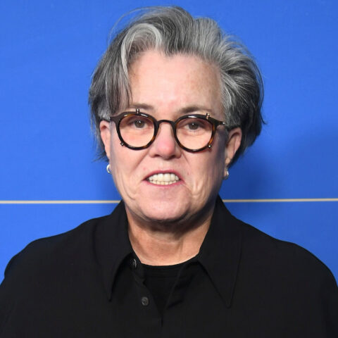 Rosie O'Donnell at press event with blue backdrop