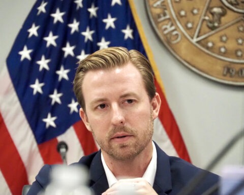 Ryan Walters speaking at a press conference in Oklahoma