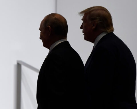 Silhouetted image of Donald Trump and Vladimir Putin walking side-by-side