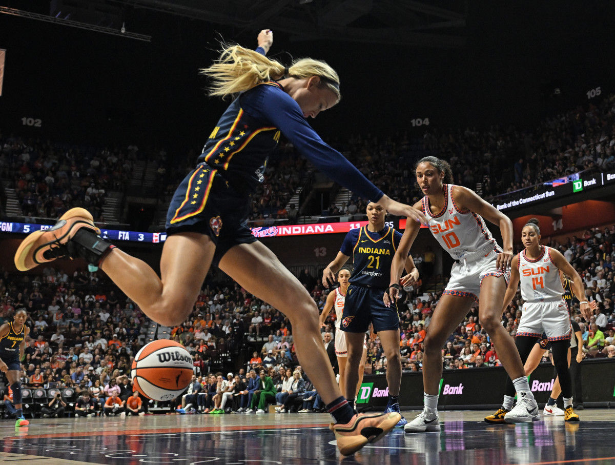 Indiana Fever player attempts to save the ball during a game against the Connecticut Sun