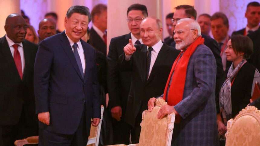 Xi Jinping, Vladimir Putin, and Narendra Modi smiling and talking at the Shanghai Cooperation Organization summit