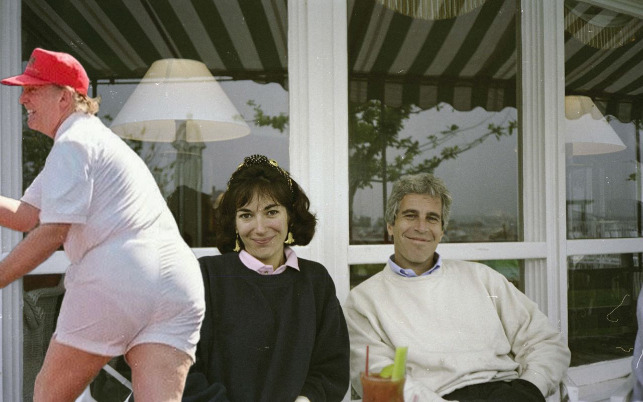 Ghislaine Maxwell and Jeffrey Epstein sitting together outdoors.