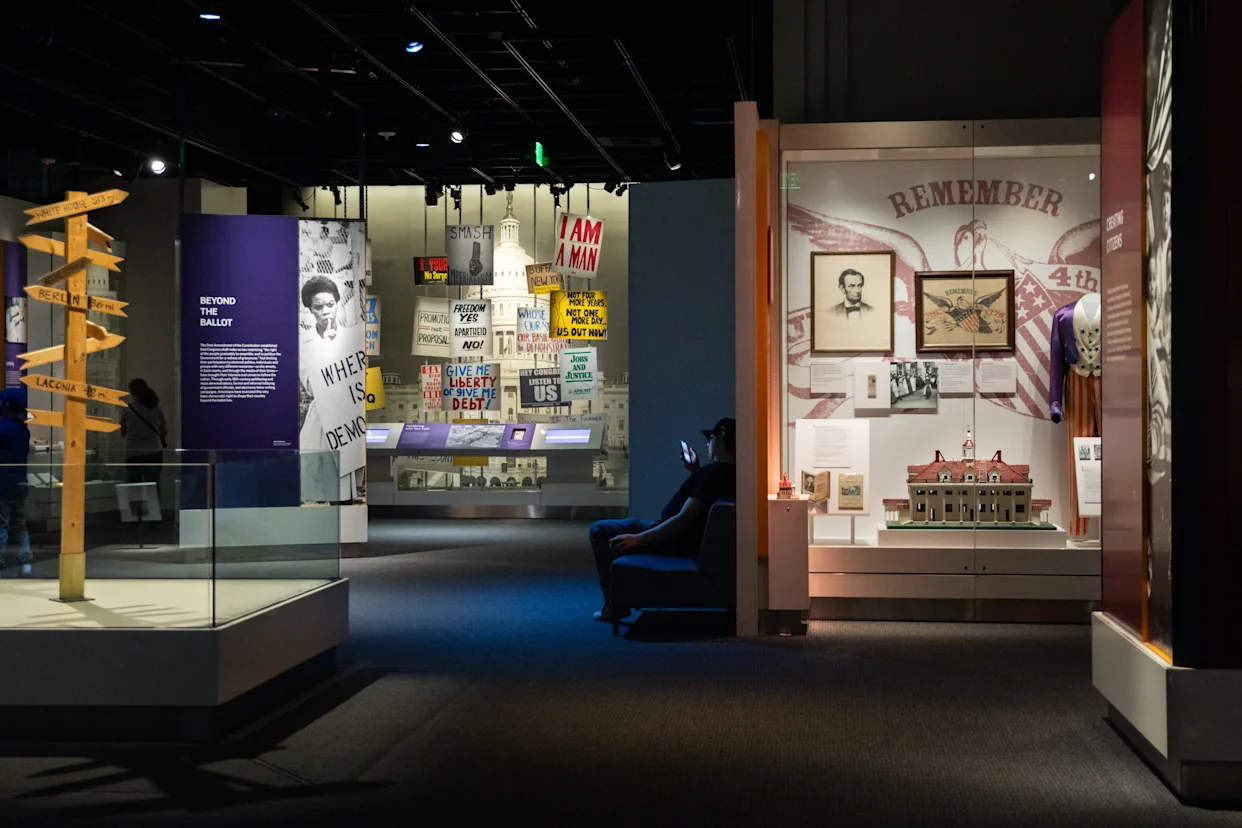 Visitors viewing historical exhibits inside the Smithsonian museum in Washington, D.C.
