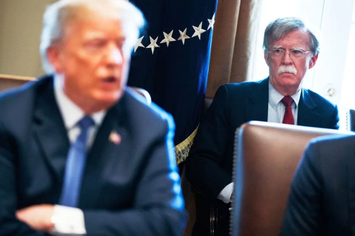 Former national security adviser John Bolton looking on during a White House meeting