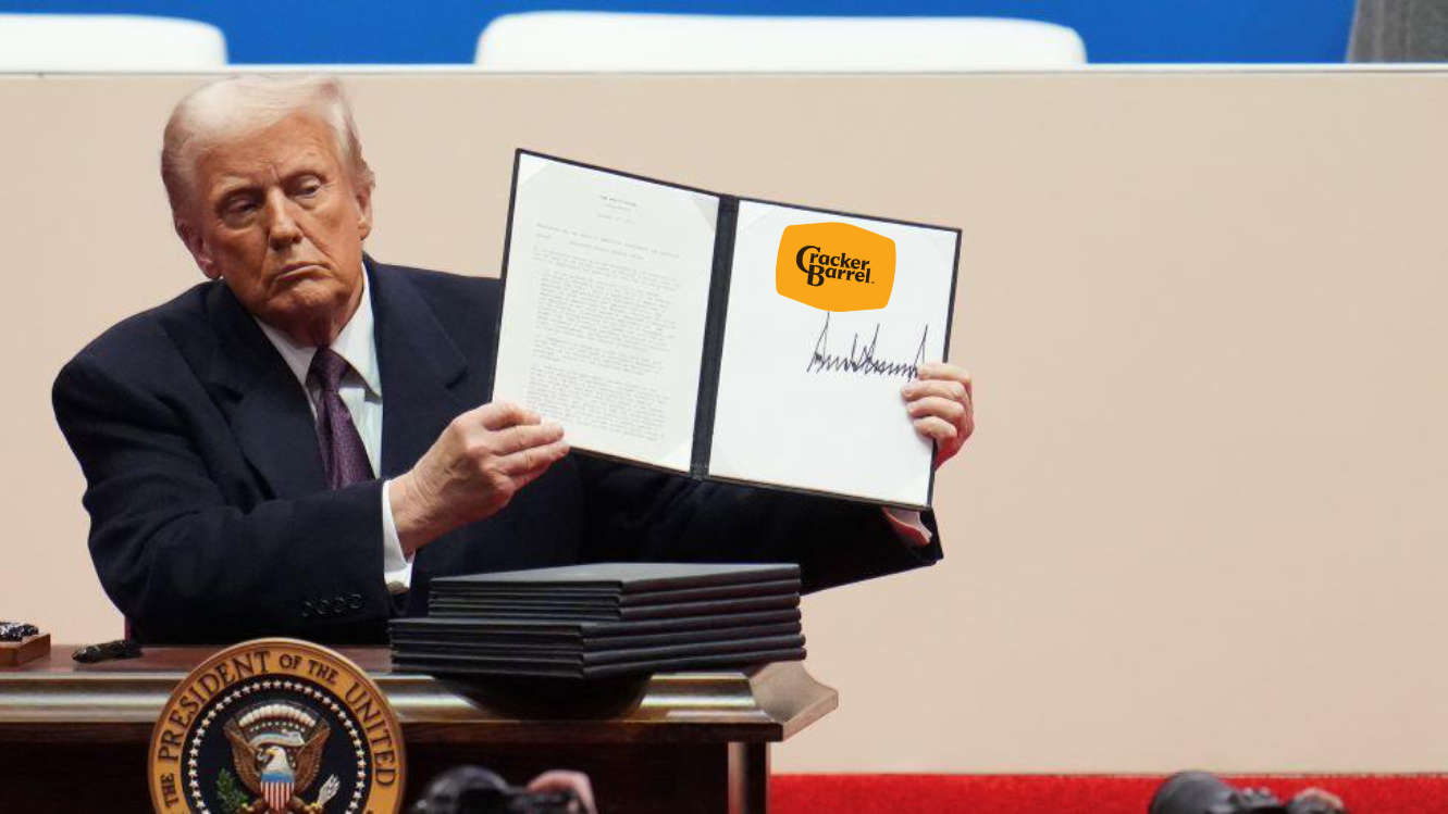 Donald Trump showing a signed EO.