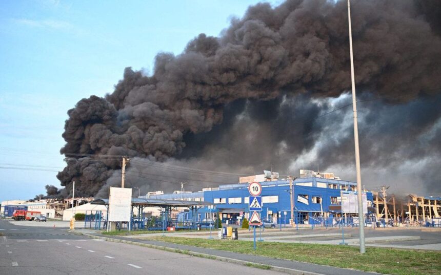 Smoke billowing from destroyed electronics factory in Ukraine after Russian missile strike