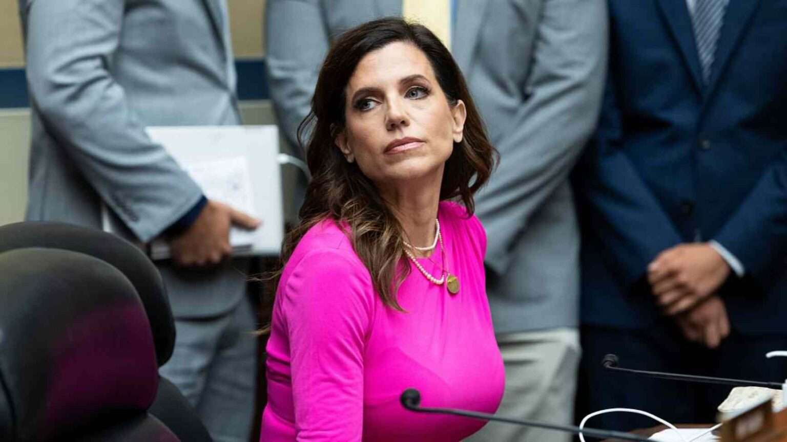 Nancy Mace at a congressional hearing wearing a pink dress.