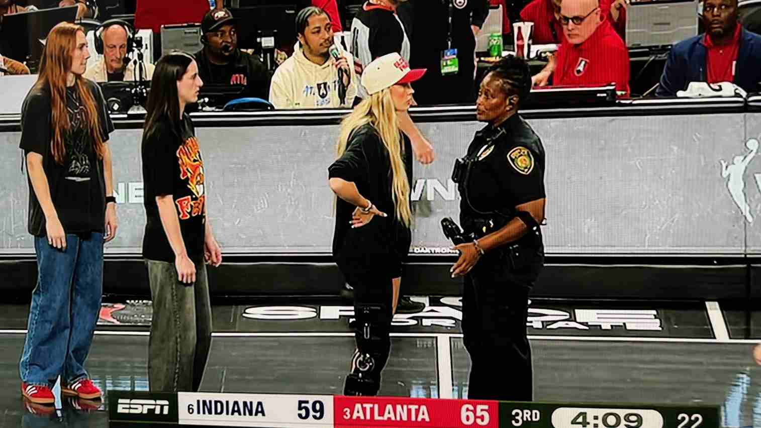 Sophie Cunningham arguing with a police officer during Indiana Fever playoff game