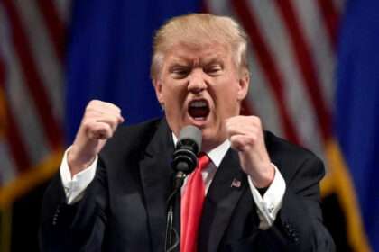 Donald Trump speaking angrily at podium