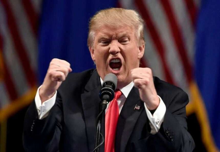 Donald Trump speaking angrily at podium