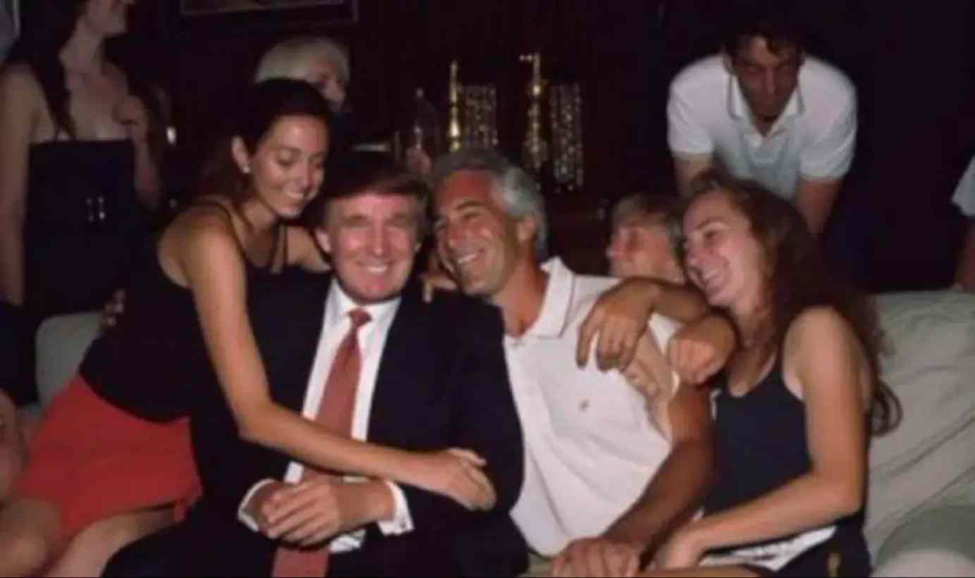 Donald Trump and Jeffrey Epstein sitting together at a party surrounded by women.