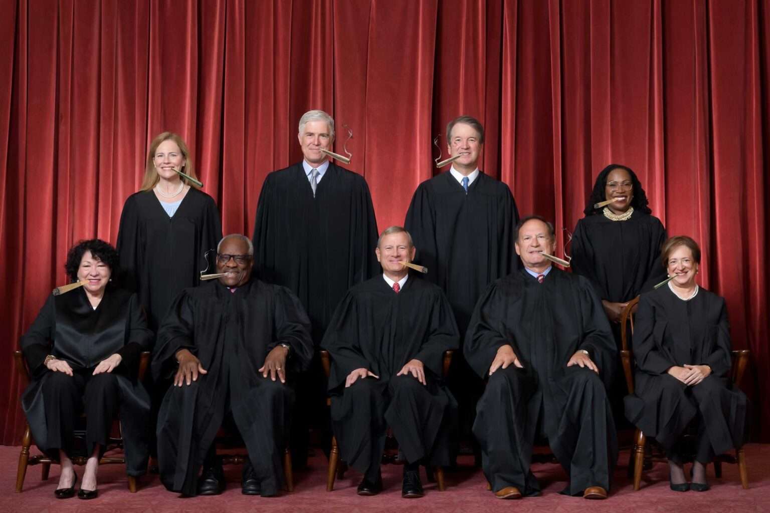 Supreme Court justices posing for official photo in robes.