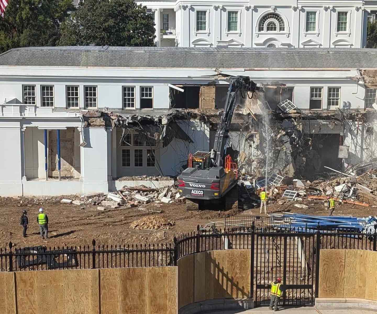 Construction machinery demolishing part of the White House East Wing