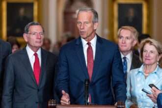 Senator John Thune speaks at a press conference surrounded by lawmakers at the U.S. Capitol.