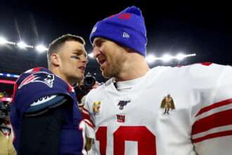 Tom Brady and Eli Manning talking after a football game