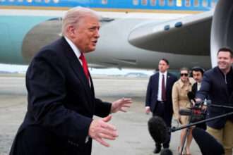 President Donald Trump speaks to reporters near Air Force One.